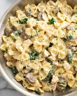 Mushroom Chicken Pasta in a skillet with creamy sauce and spinach.