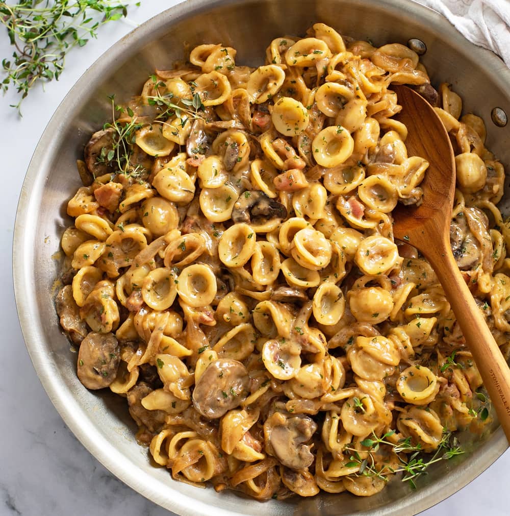 A skillet of French Onion Pasta with mushrooms and pancetta.