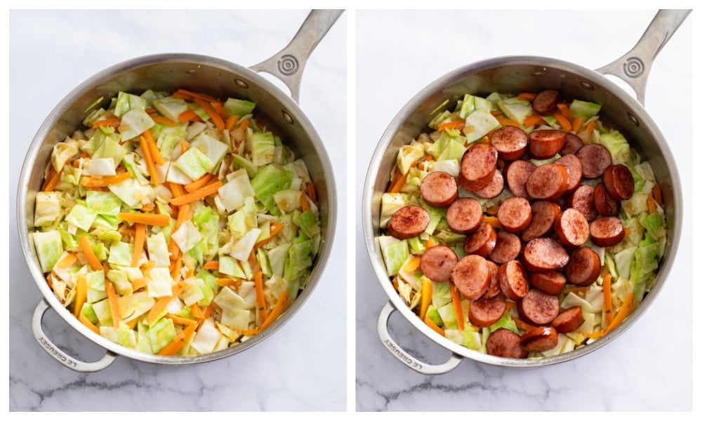 A skillet of cooked cabbage and carrots with sausage slices being added.