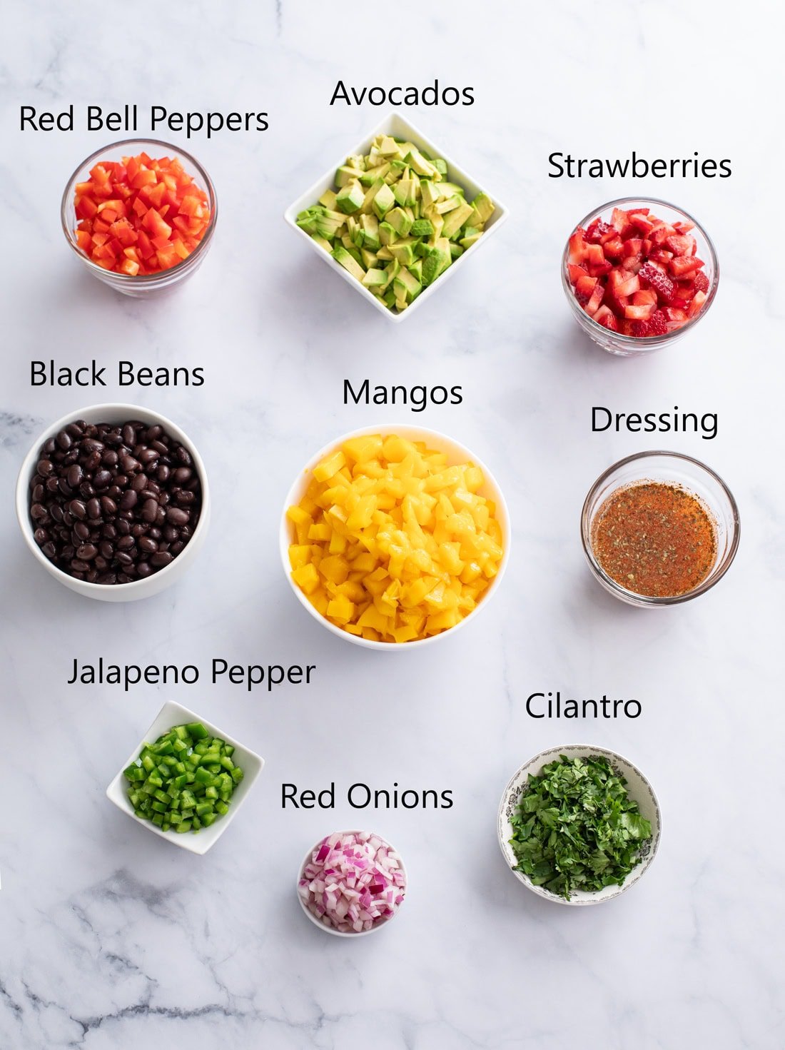 Ingredients for Mango Salsa on a white surface with labels.