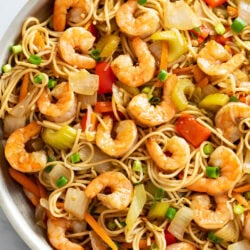 Shrimp Lo Mein in a skillet with vegetables, noodles, and sauce.