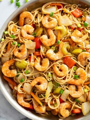 Shrimp Lo Mein in a skillet with vegetables, noodles, and sauce.