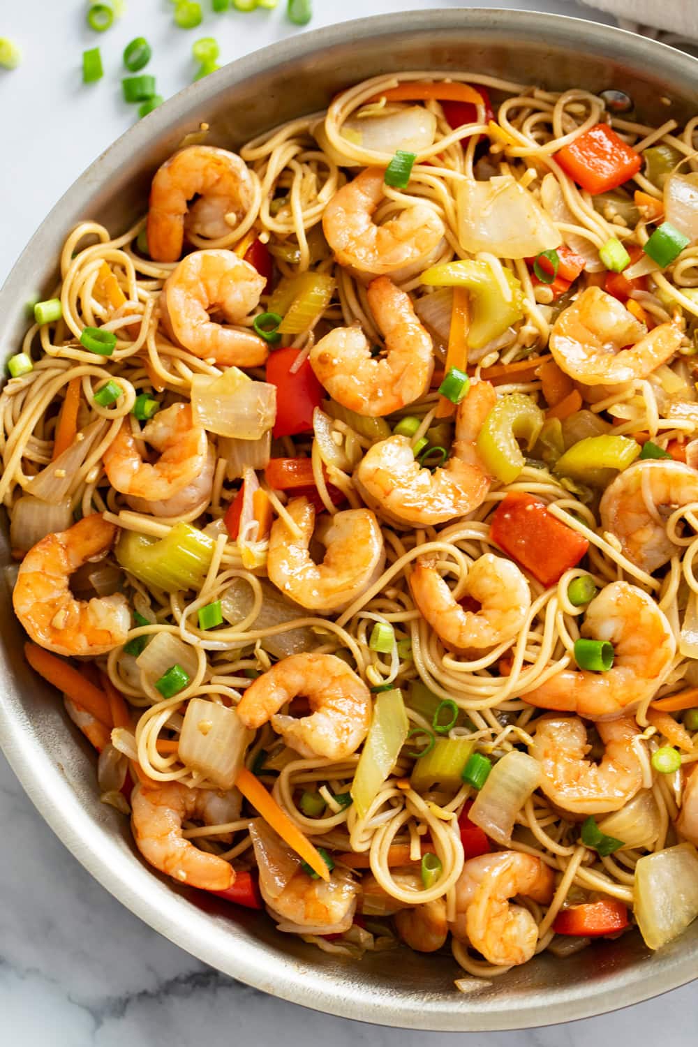 Shrimp Lo Mein in a skillet with vegetables, noodles, and sauce.