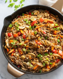 Beef Ramen Noodles in a skillet with ground beef, vegetables, and stir fry sauce.