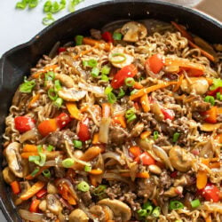 A labeled picture of Ground Beef Ramen Noodles in a skillet with vegetables.