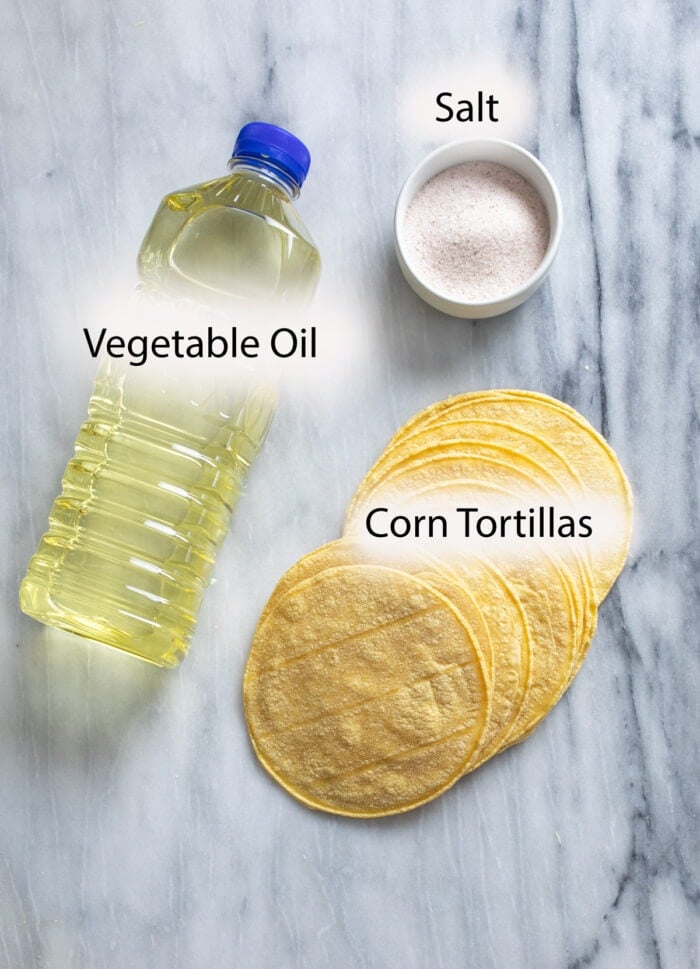 Ingredients for making Homemade Tortilla Chips on a white surface.