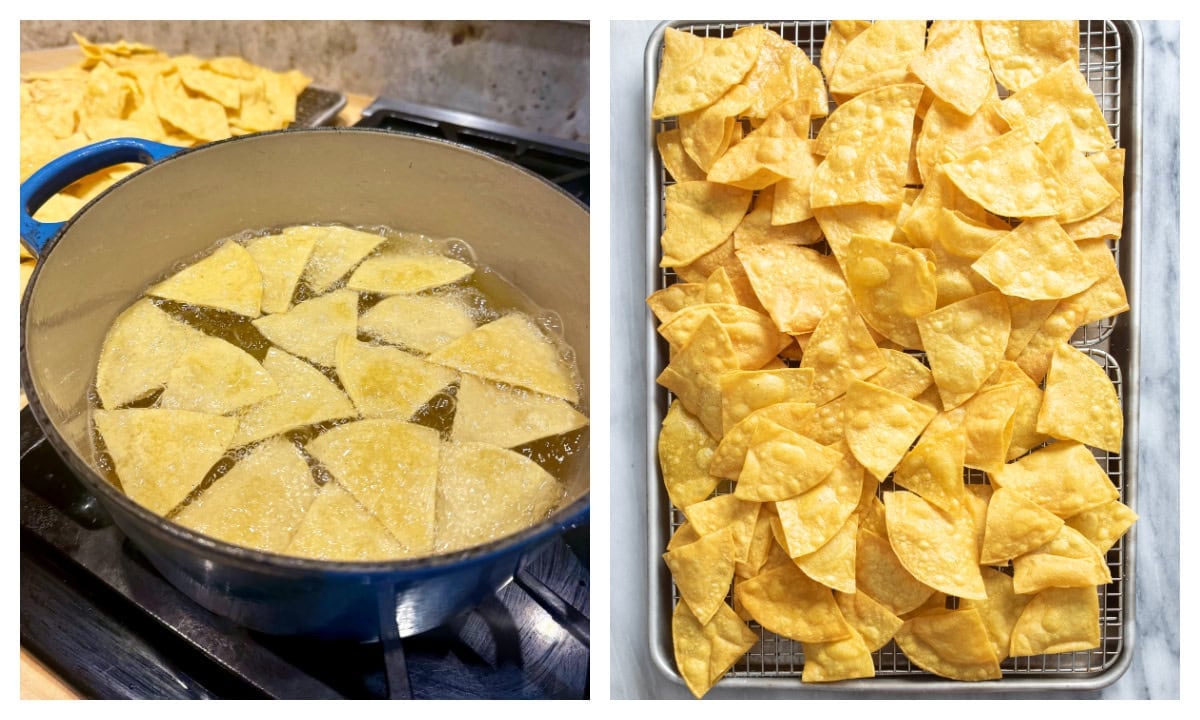 A Dutch oven with tortilla chips being fried next to cooling racks with fried tortilla chips.