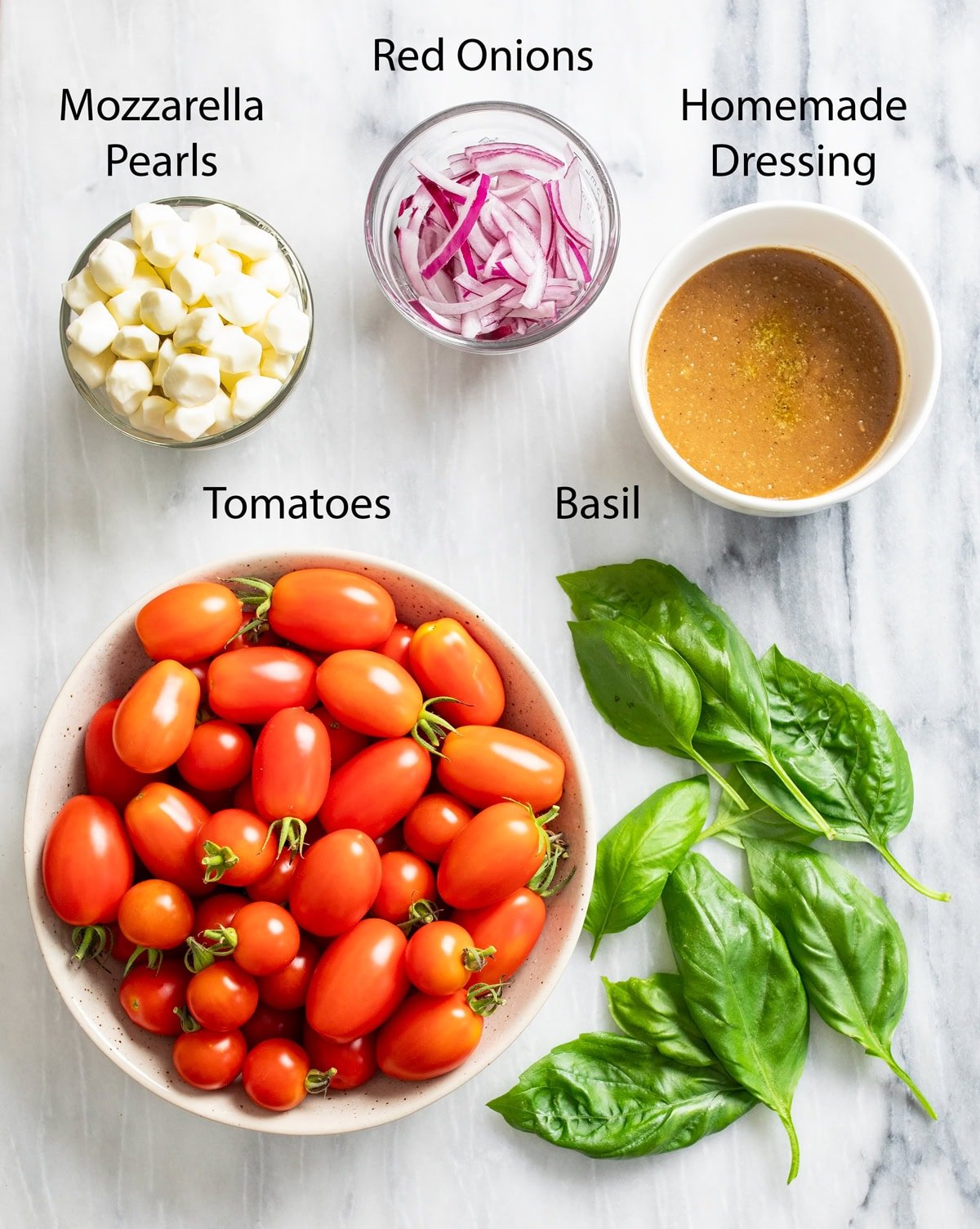 Overhead view of ingredients needed to make Tomato Salad.