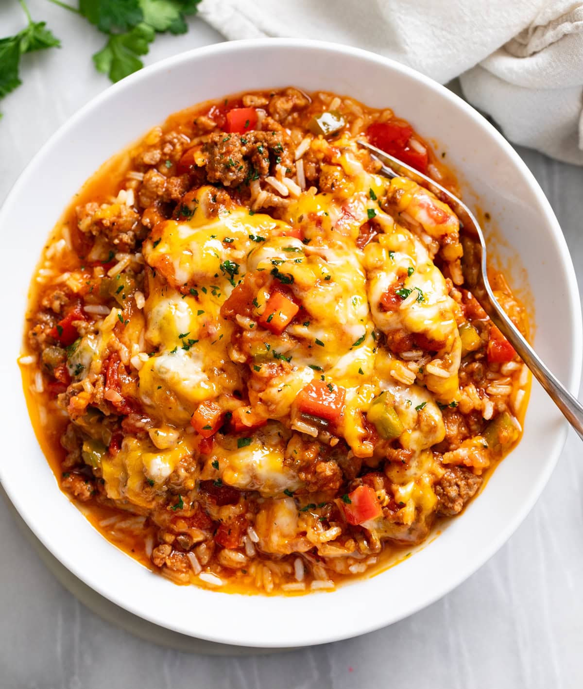 Unstuffed Peppers in a white bowl with a fork on the side.