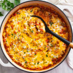 Unstuffed Peppers in a skillet with ground beef, sausage, rice, tomatoes, and cheese.
